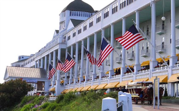 visiting Mackinac Island - Grand Hotel by MightyMac.org 7 Rules to Live by when Visiting Mackinac Island. Many people think that being a fudgie is a bad thing, suppose it depends on how you look at it. Either way, if you follow these tips you'll be just fine, haha! #TheTwinCedars #MackinacIsland #Michigan #travel #tourism 