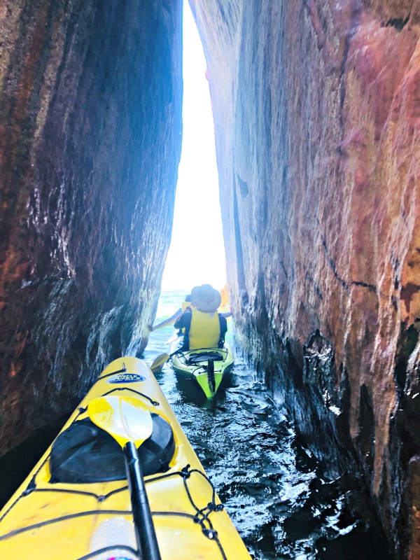 Kayaking Pictured Rocks through the crevice
