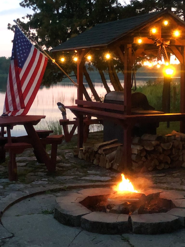 Cozy lakefront campfires at Twin Cedars Resort