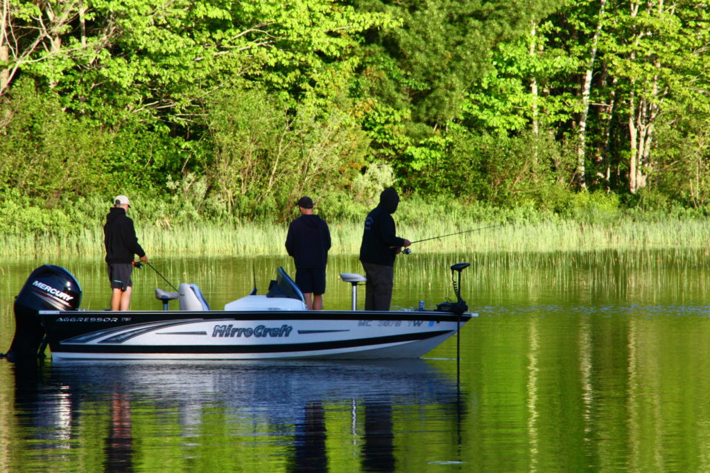 Fishing on the calm Frenchman Lake at Twin Cedars Resort